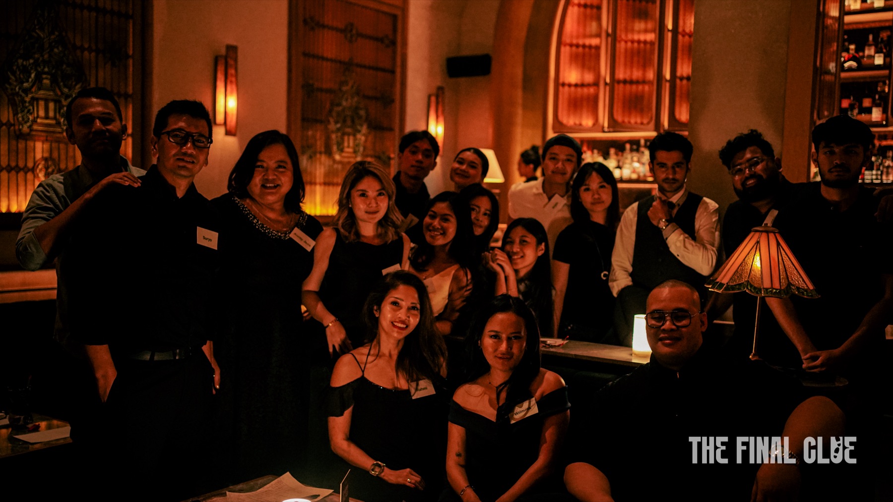 A dim, warmly lit event space during an immersive performance in Jakarta.